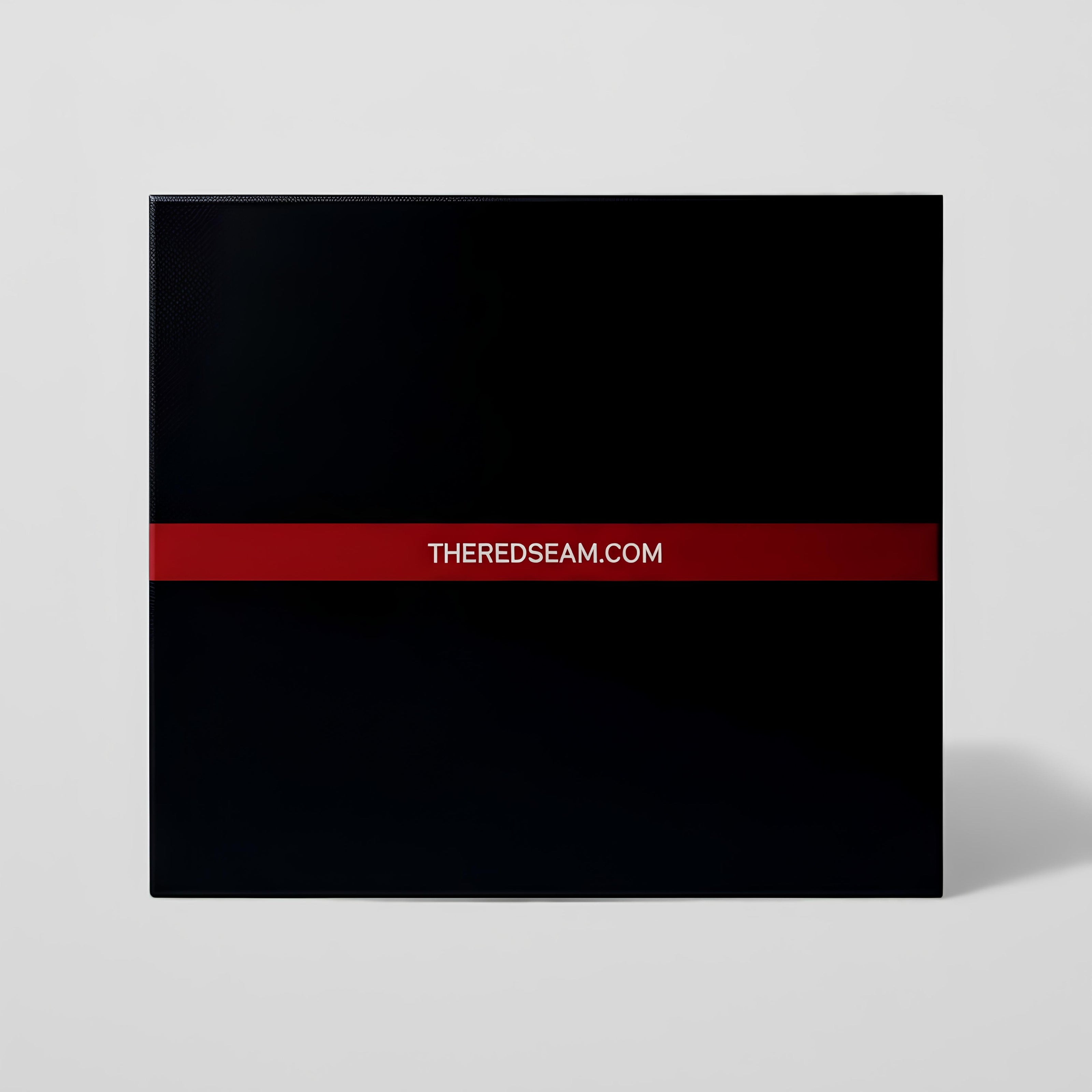 Black album cover with a red stripe and 'THE RED SEAM.COM' text on a light gray background