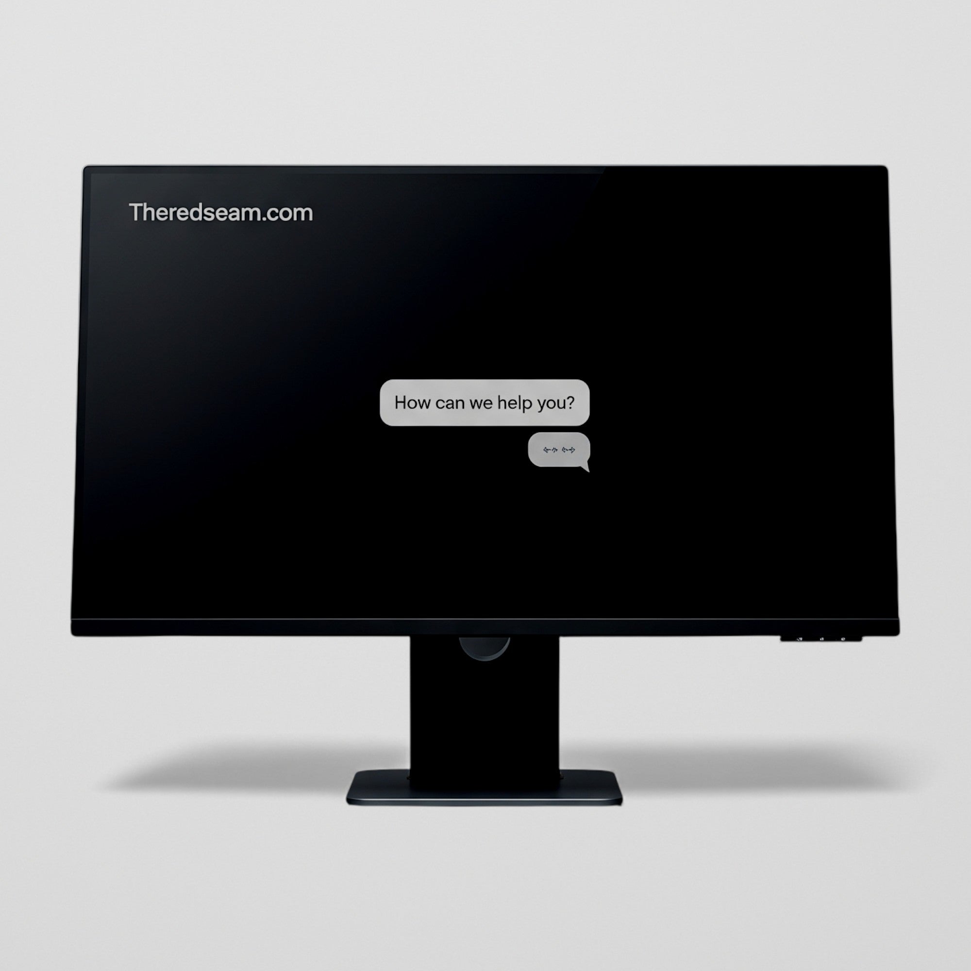 Black computer monitor on a light gray background with 'Theredseam.com' displayed.
